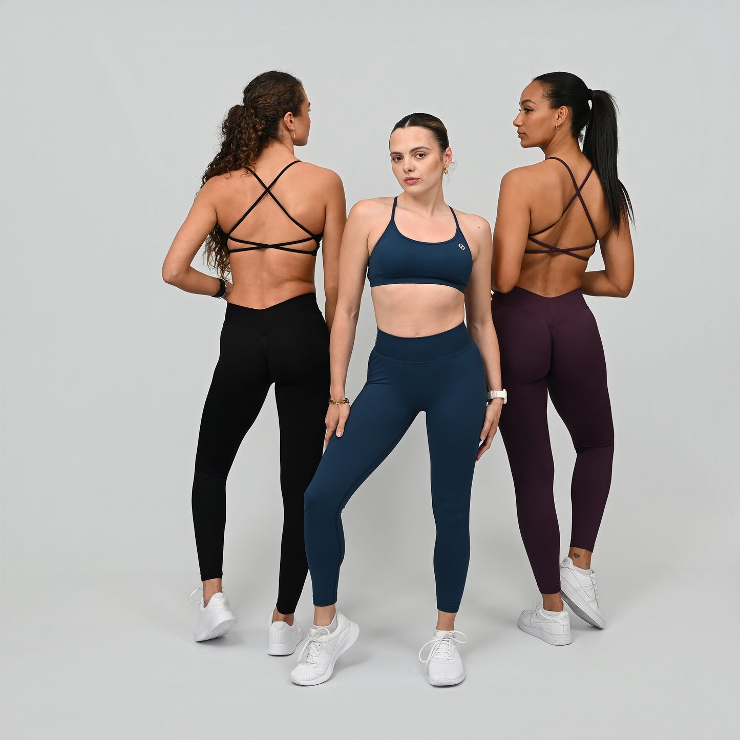 Three women wearing Hybryd matching gymwear sets