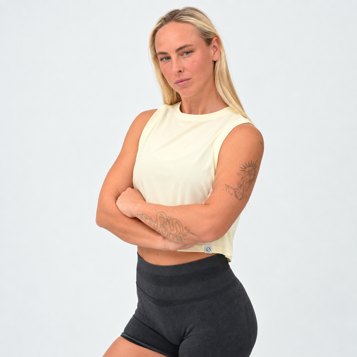 Women’s Ivy Crop Vest in butter, front view showing the relaxed cropped fit and high neckline.
