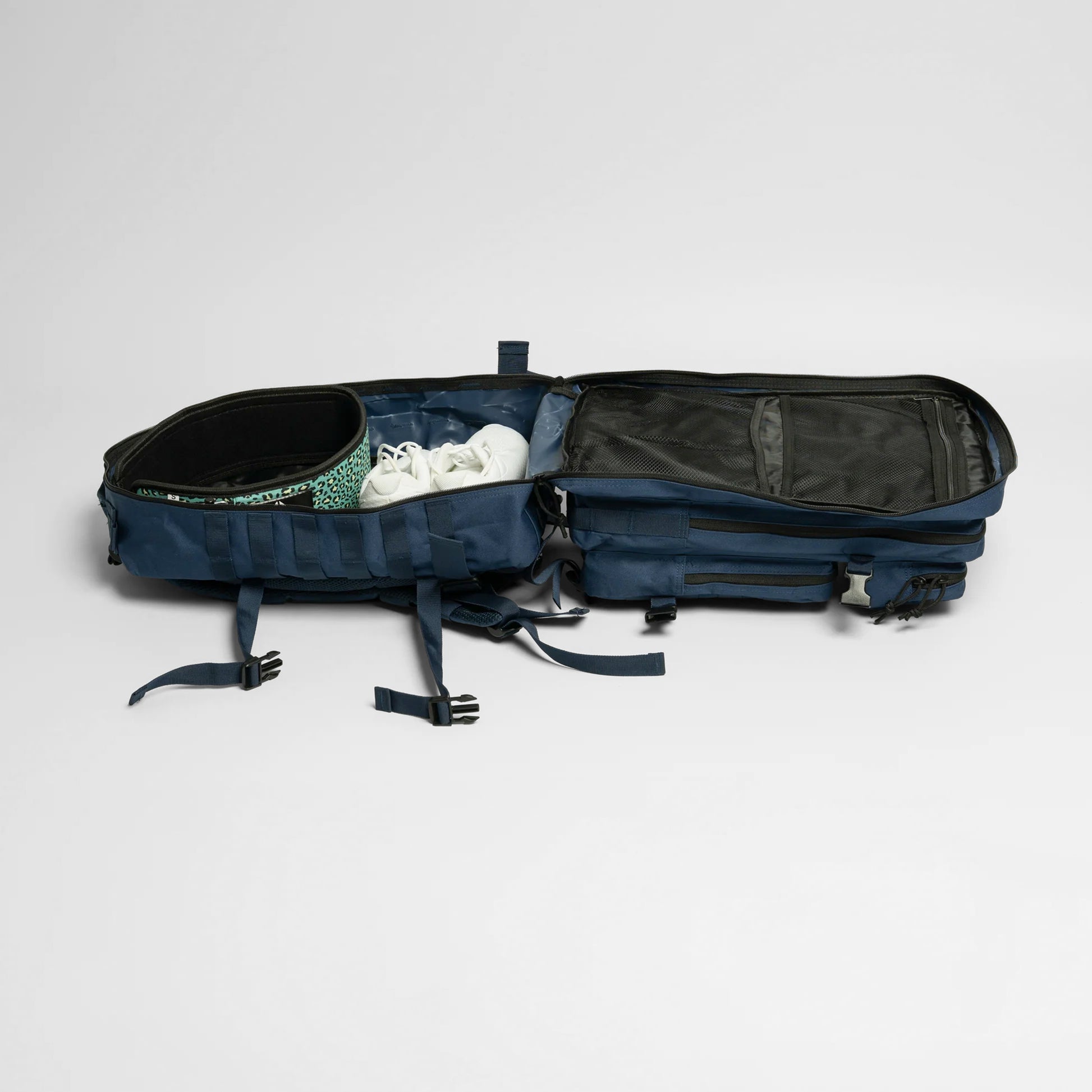 Open navy blue military backpack unzipped