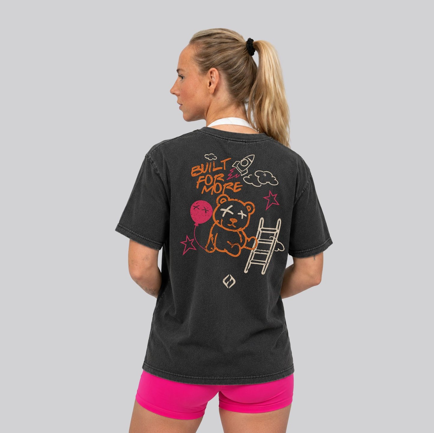 Woman Wearing Washed Black Crossfit moto T-shirt_Built For More_ Back View - By Hybyrd