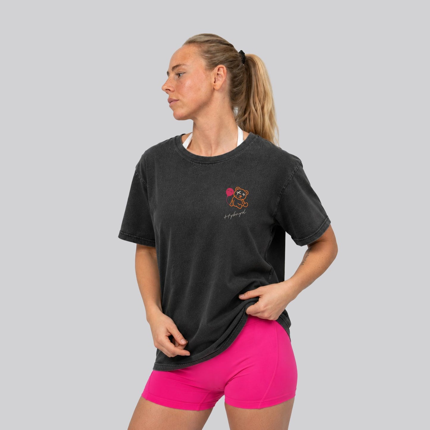 Woman Wearing Washed Black Crossfit moto T-shirt_Built for more_ Back View - By Hybyrd