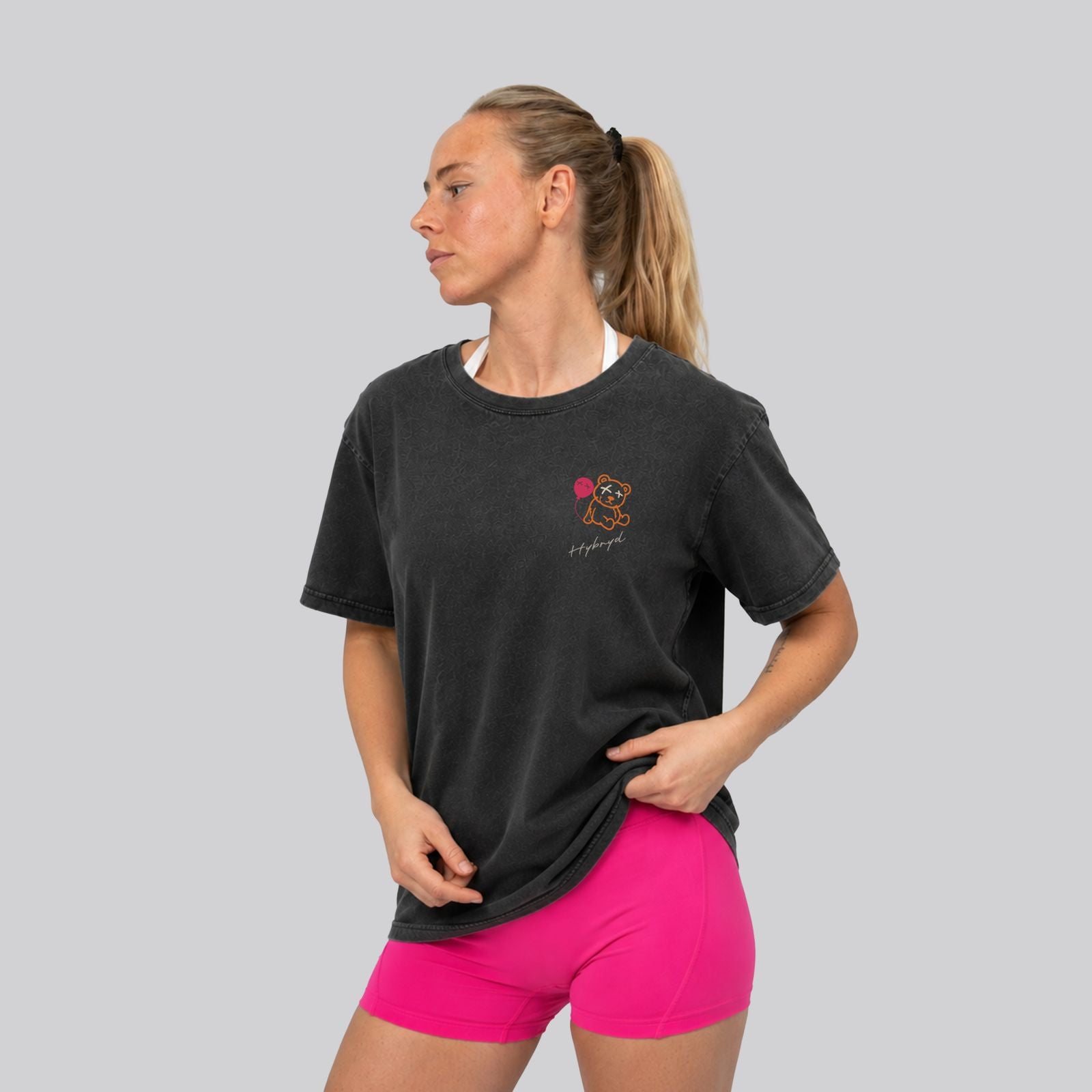 Woman Wearing Washed Black Crossfit moto T-shirt_Built for more_ Back View - By Hybyrd