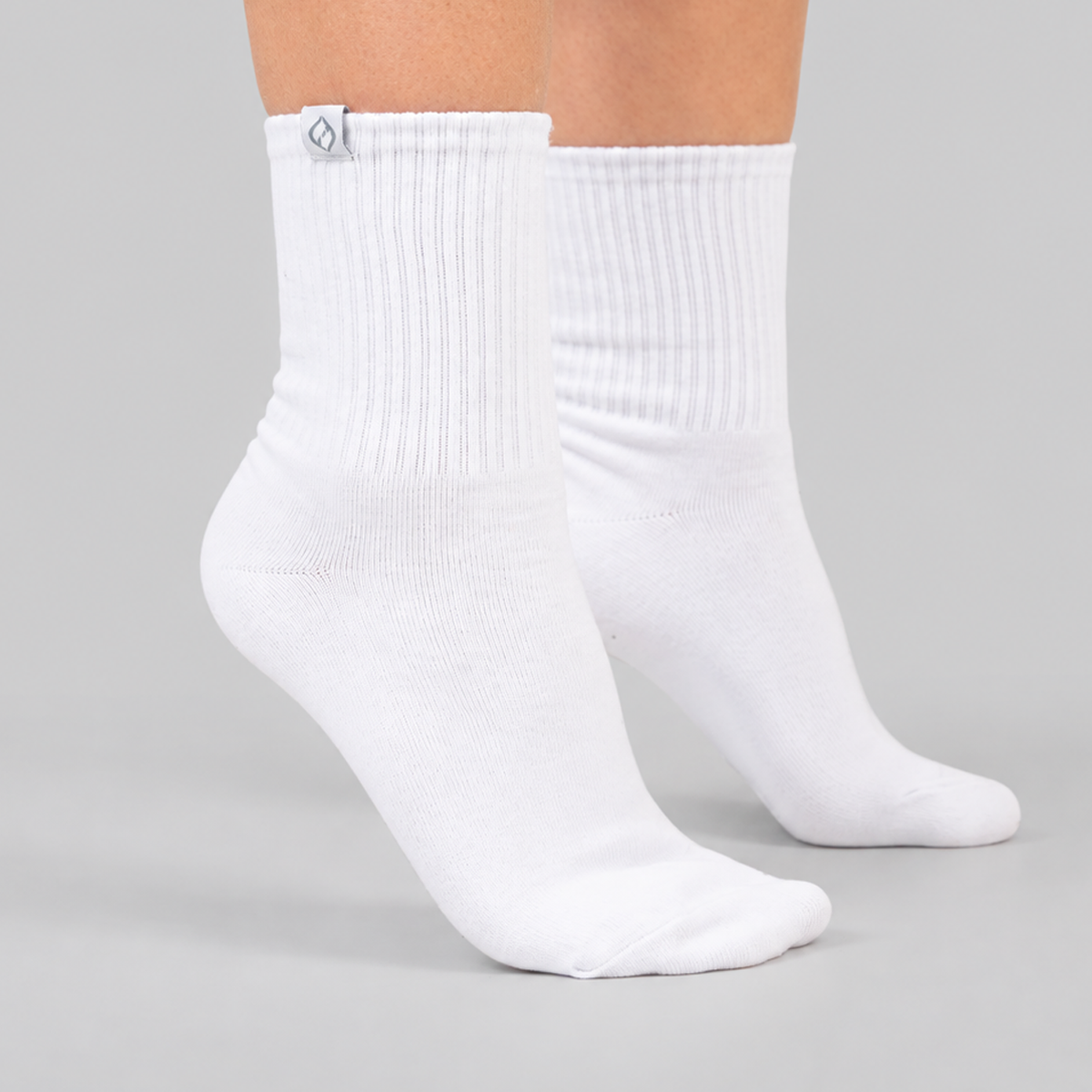 Close-up view of Hybryd white cotton rich sport socks showing logo detail