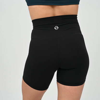 Crossfit girl wearing plain black, high waisted bootie shorts. No cinch. From activewear brand Hybryd.
