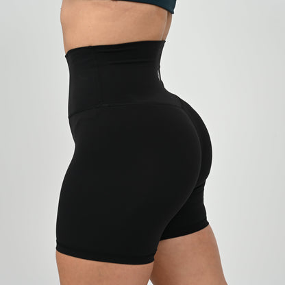 Crossfit girl wearing plain black, high waisted bootie shorts. No cinch. From activewear brand Hybryd.