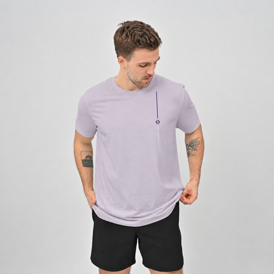 A Hyrox athlete wearing  cotton lilac T-shirt and black gym shorts from crossfit brand Hybryd