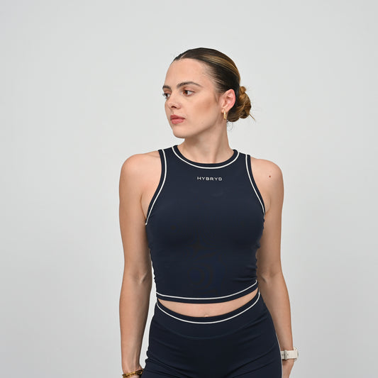 Hyrox model wearing a navy athletic gym top with white contrast piping.