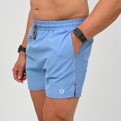 A crossFit athlete wearing a pair of swim shorts with draw string waist. Made by activewear brand Hybryd.