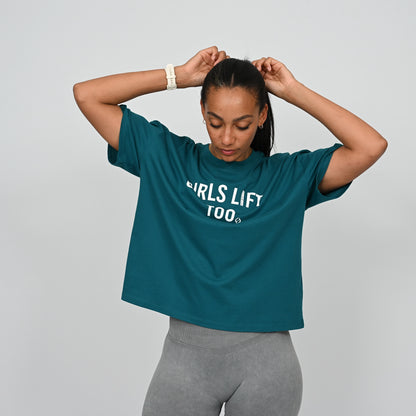 Woman wearing a teal t-shirt with 'GIRLS LIFT TOO' text on From the brand Hybryd