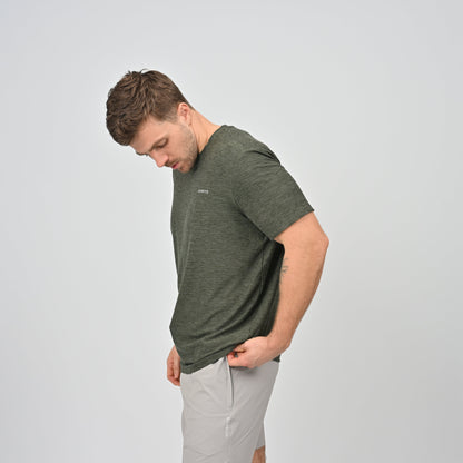 Man wearing a green Hybryd gym t-shirt and sports shorts