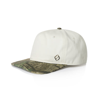 A Hybryd baseball cap with an off-white crown and a green and brown camouflage patterned brim, featuring a small camo Hybryd logo on the front.
