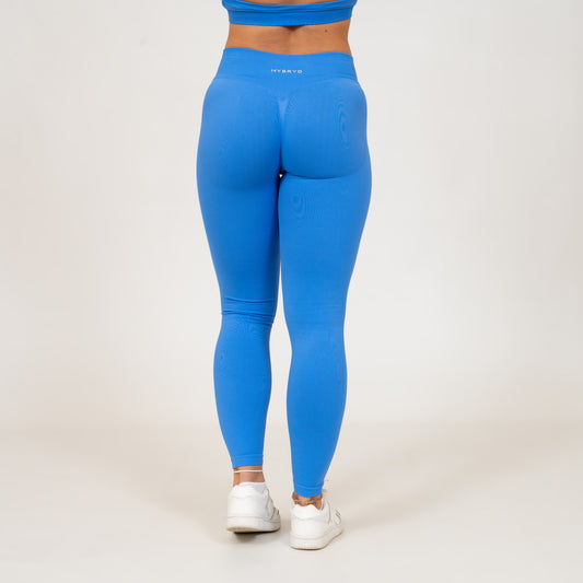 Rear picture of woman wearing blue Hybryd gym leggings