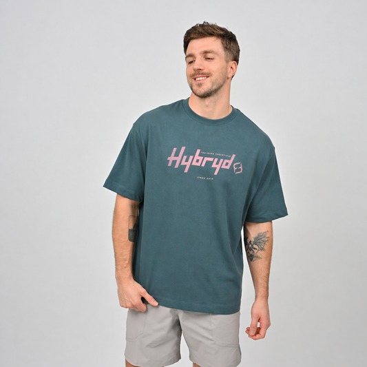 Oversized Hybryd Teen in teal, worn with Hybryd workout shorts for the gym