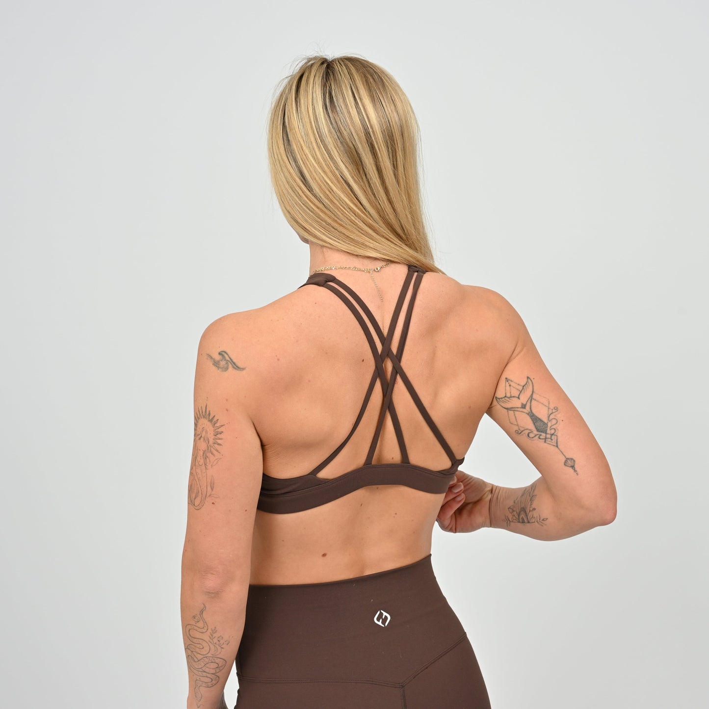 Brown High neck sports bra from Hybryd.
