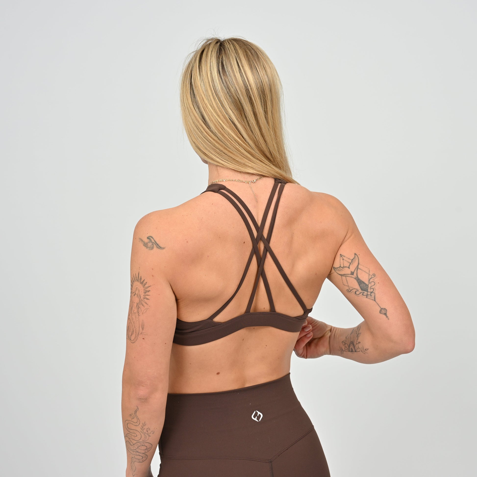 Brown High neck sports bra from Hybryd.