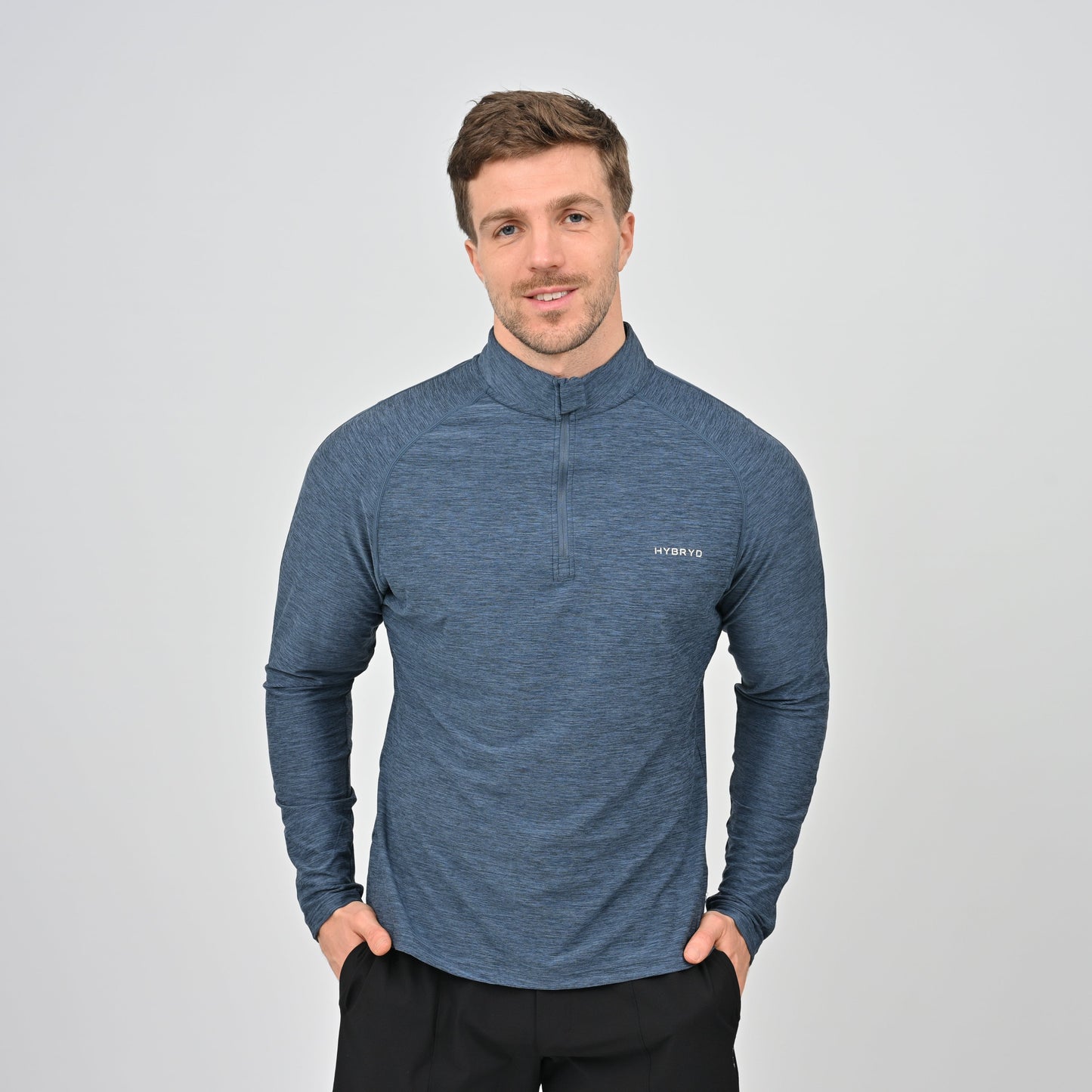 Hybryd athlete wearing a blue long-sleeve baselayer