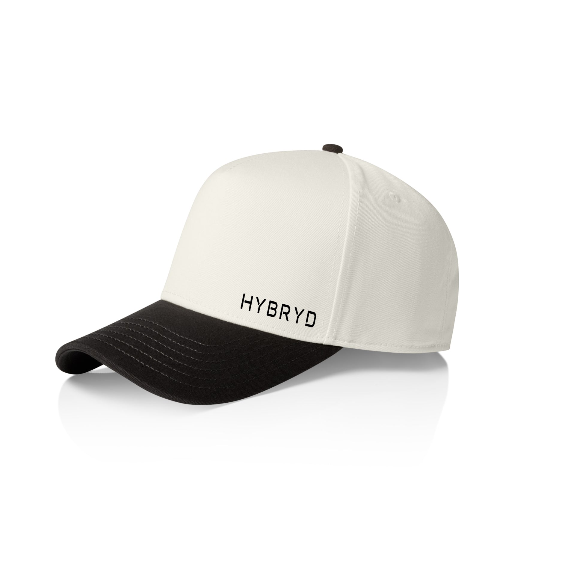 A structured baseball cap with an off-white crown and a black curved brim, featuring the word 'HYBRYD'  in black on the front. The cap is photographed on a clean white background with a soft reflection underneath.