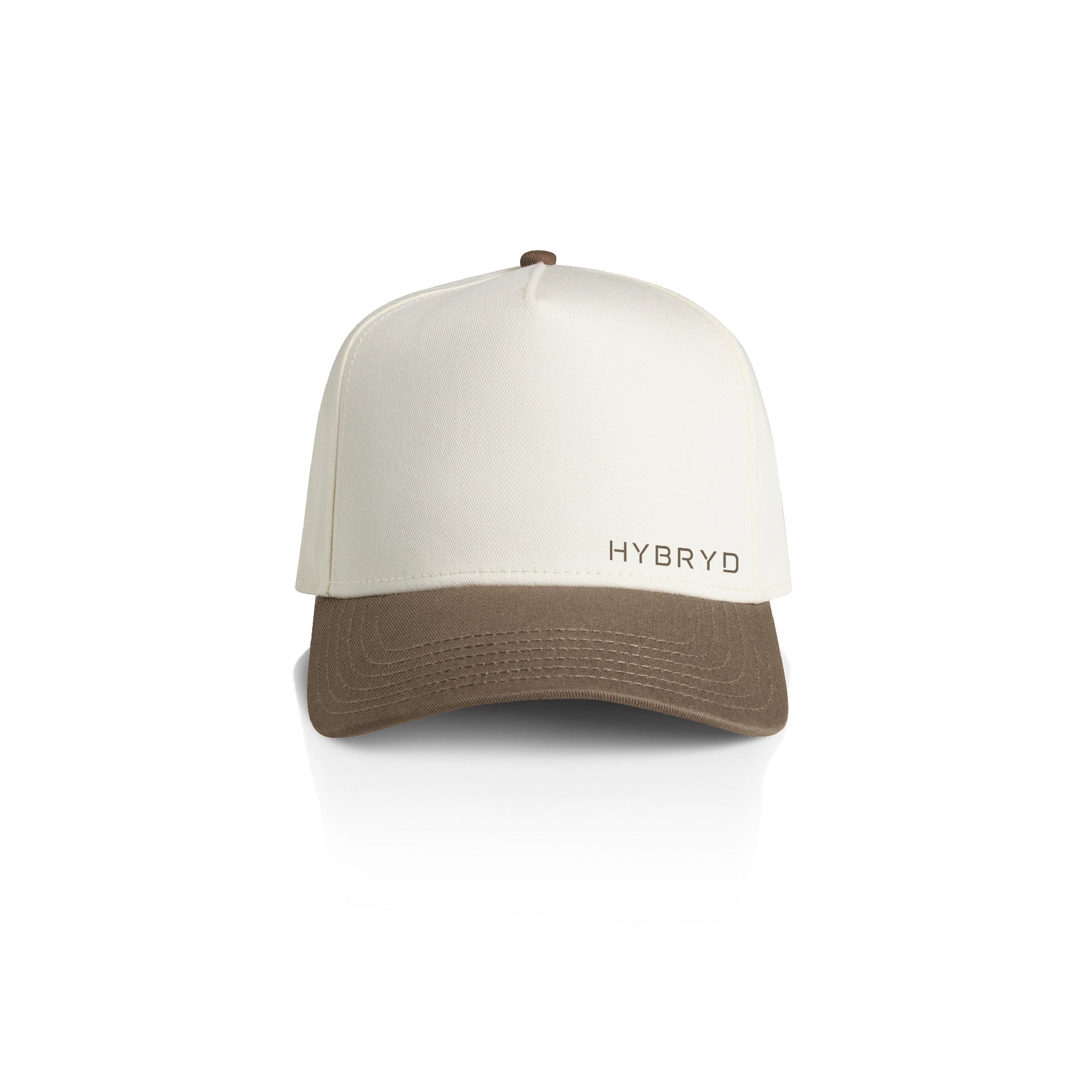 A structured baseball cap with an off-white crown and a brown curved brim, featuring the brand name 'HYBRYD' on the front. The cap is photographed on a clean white background with a soft reflection underneath.