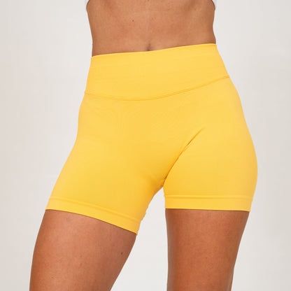 Yellow booty shorts for the gym on a crossfit athlete
