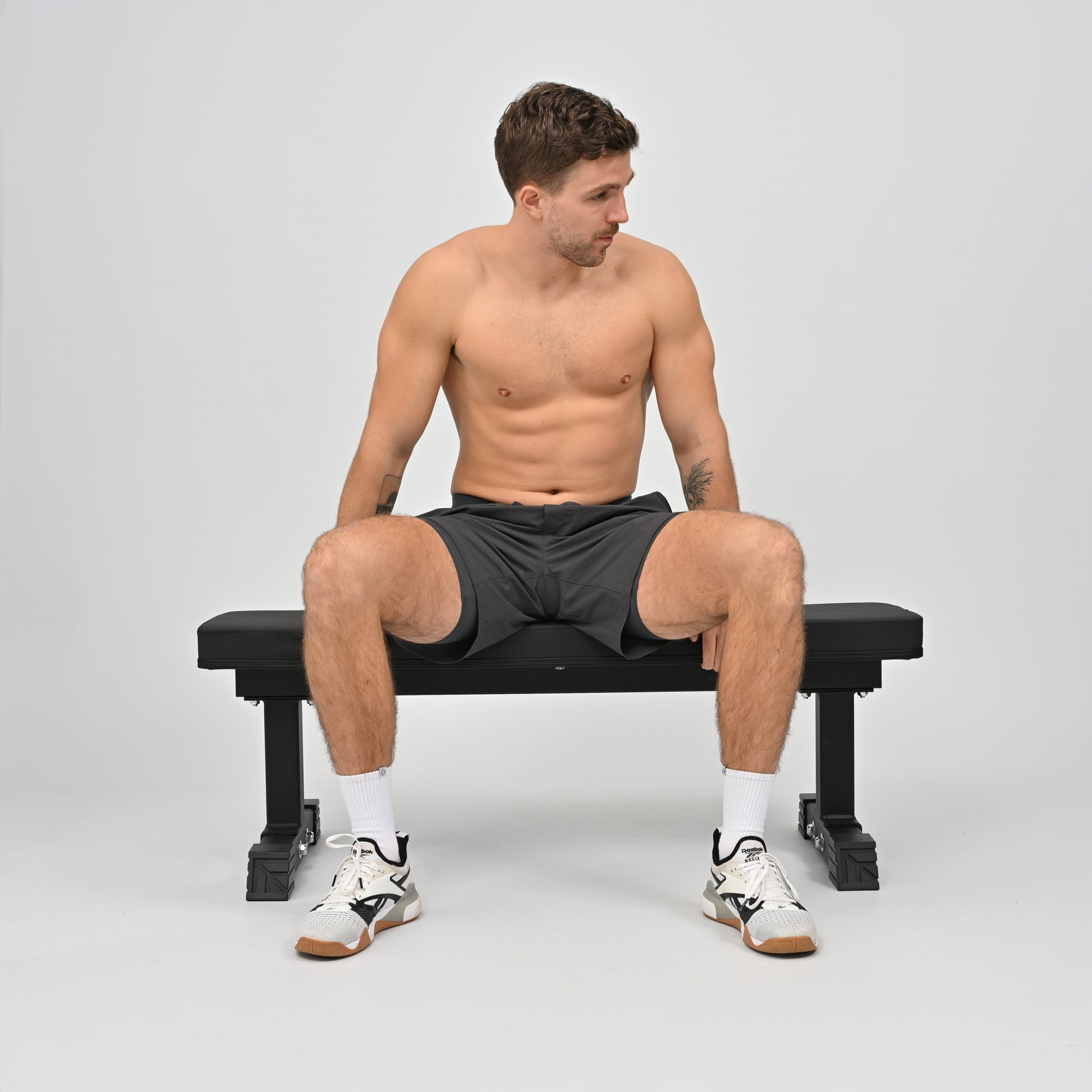 Hybryd athlete sitting in premium activewear gym shorts hidden media pocket