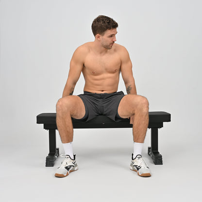Hybryd athlete sitting in premium activewear gym shorts hidden media pocket