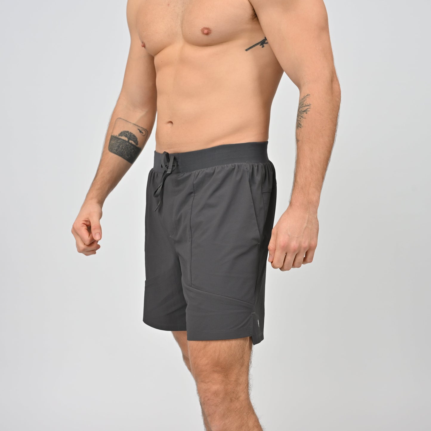 Hybryd man in grey runner shorts with waistband
