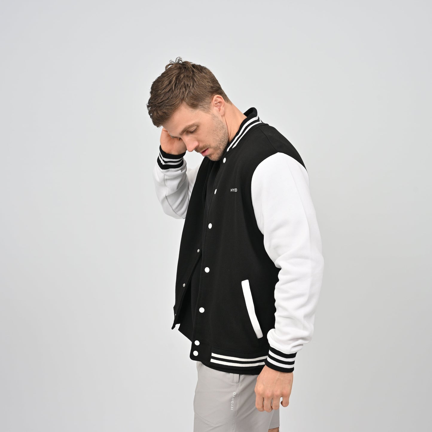 Hybryd varsity black and white popper up back print jacket.