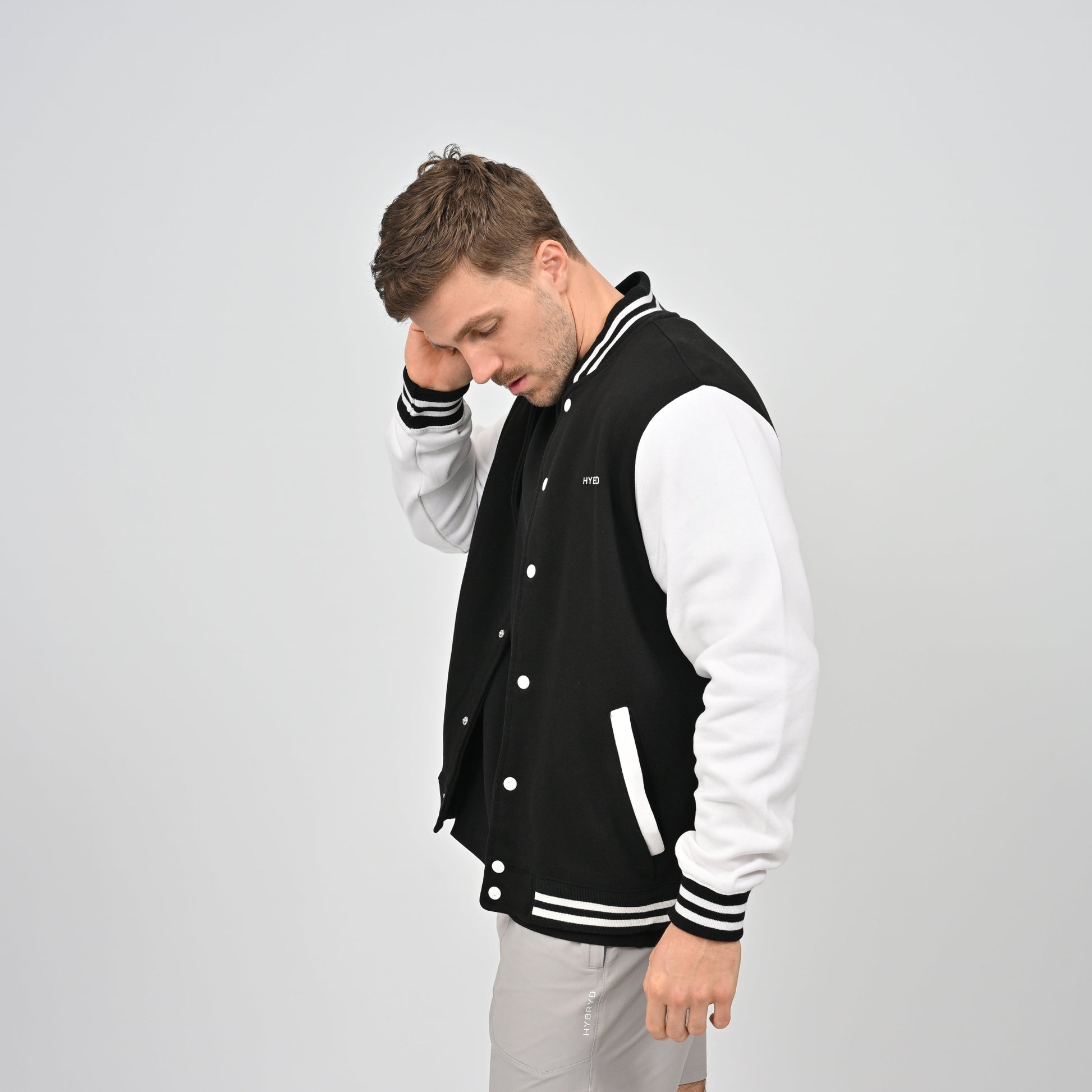 Hybryd varsity black and white popper up back print jacket.