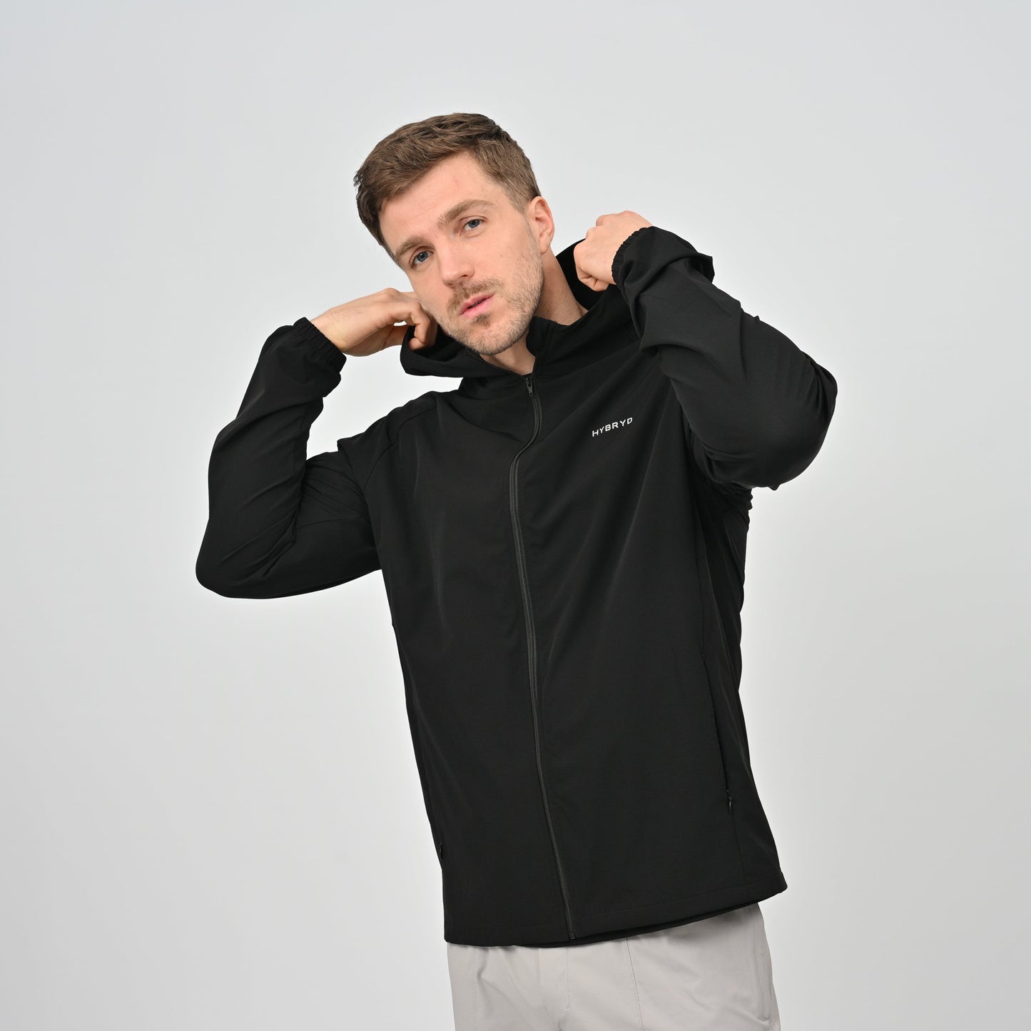 Athlete wearing a black jacket with a zip