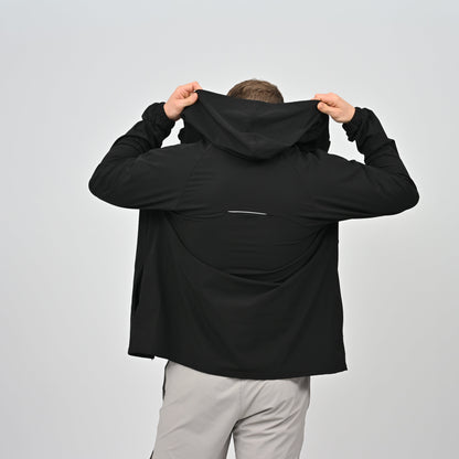 Hybryd athete wearing a black anorak with a hood