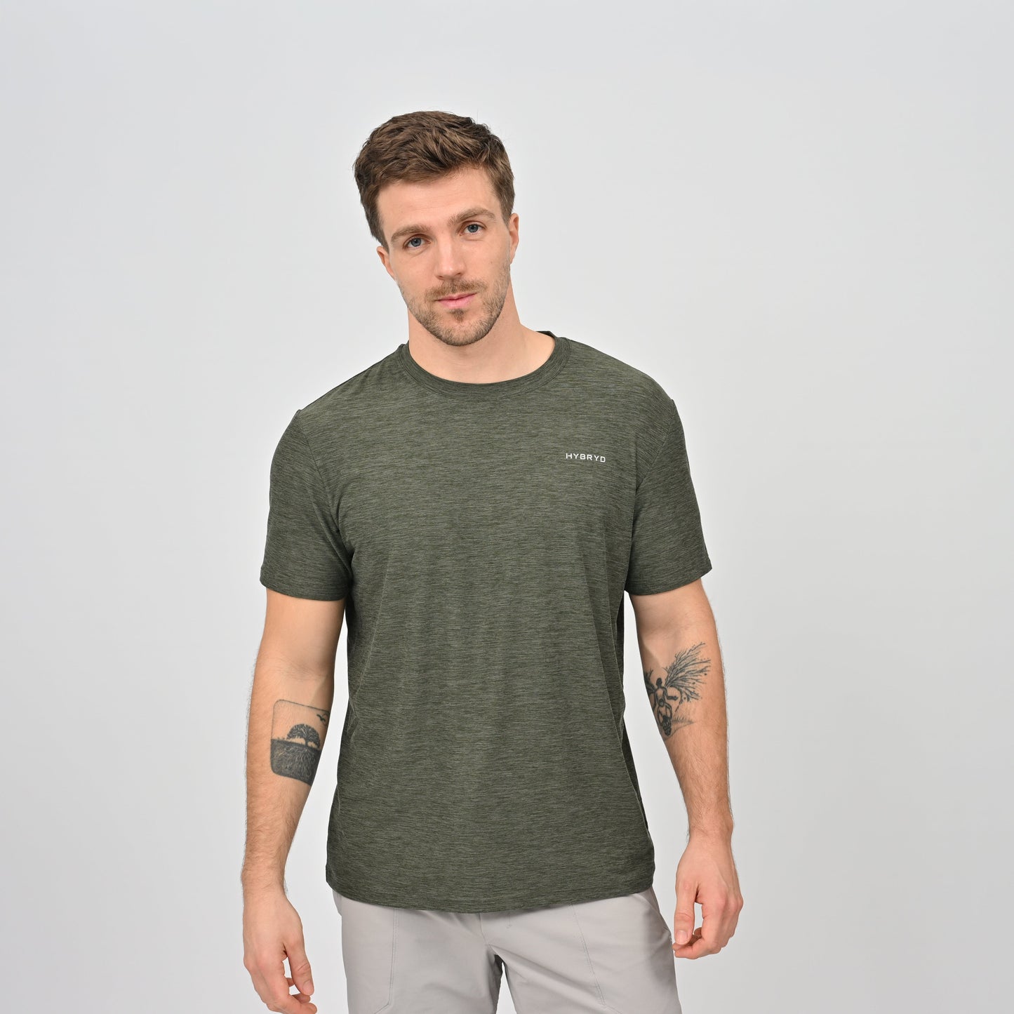 Hybryd man wearing a green t-shirt with a logo and round neck