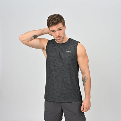 Man wearing a dark grey sleeveless gym vest from logo