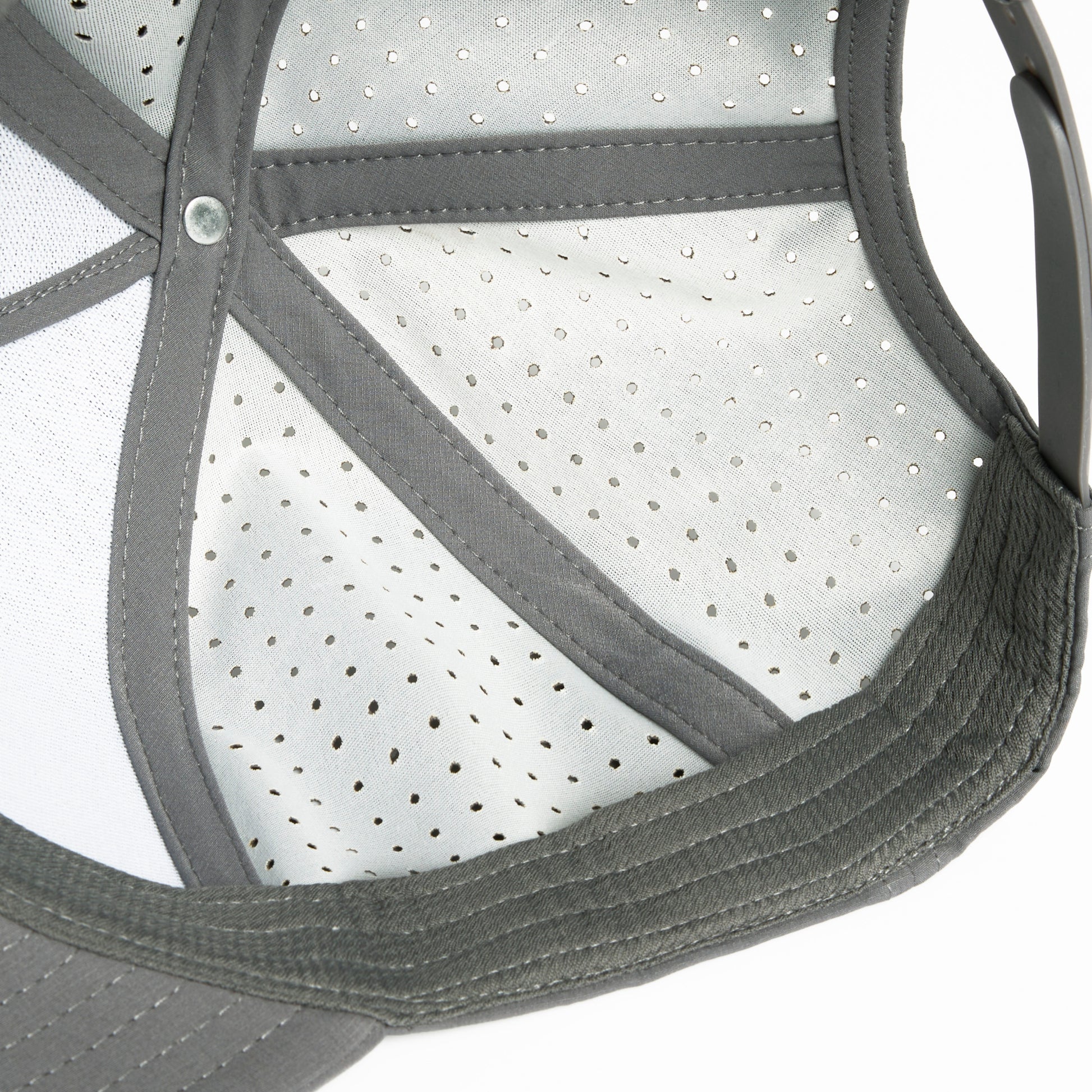 A grey Hybryd athletic baseball cap with perforated back panels and a snapback, white Hybryd logo on the front, showing the inside.