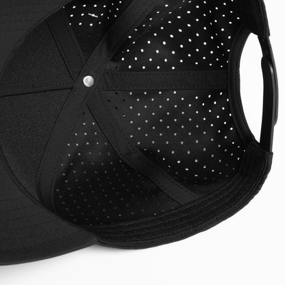 A black Hybryd athletic baseball cap with perforated back panels and a snapback, white Hybryd logo on the front, showing the inside.