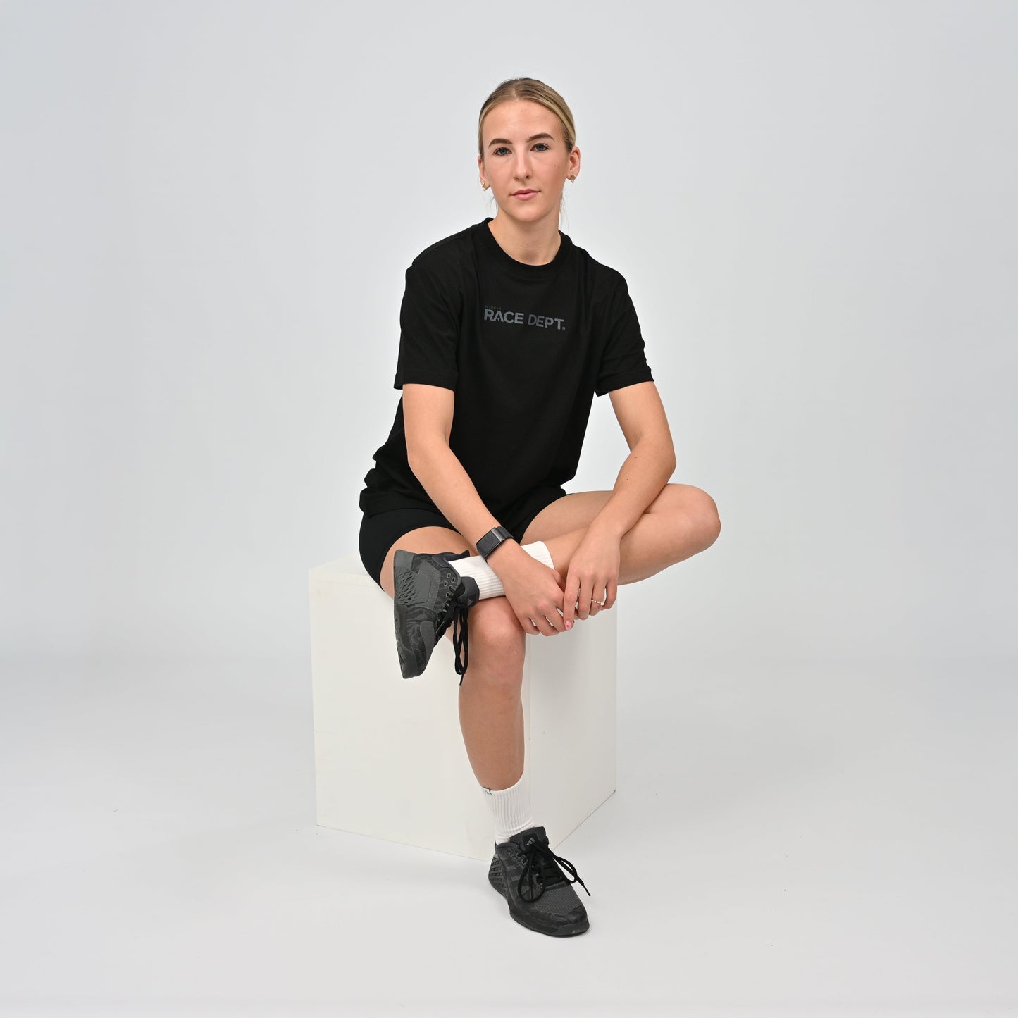 Woman wearing a black Hybryd t-shirt