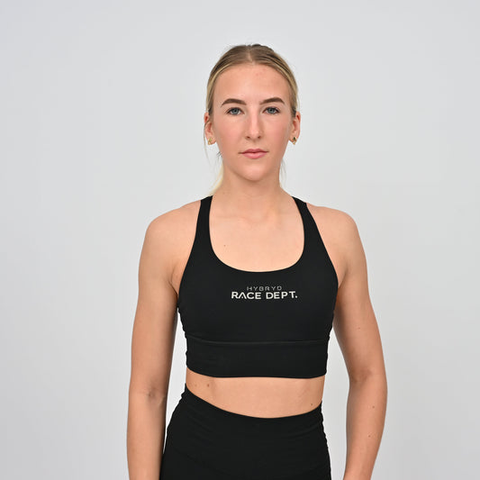 Woman wearing black sports bra for running and hyrox