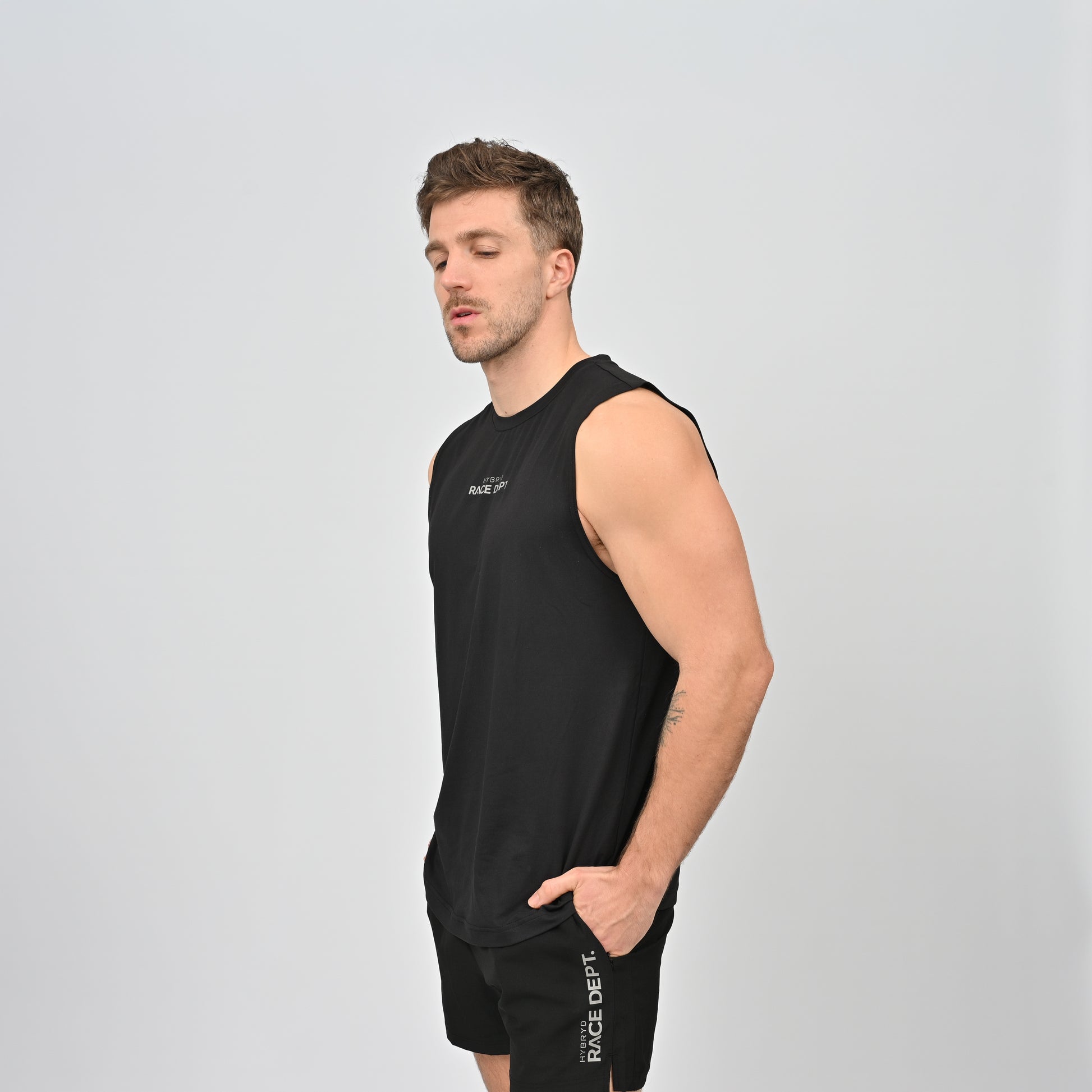 Man wearing a black sleeveless athletic shirt