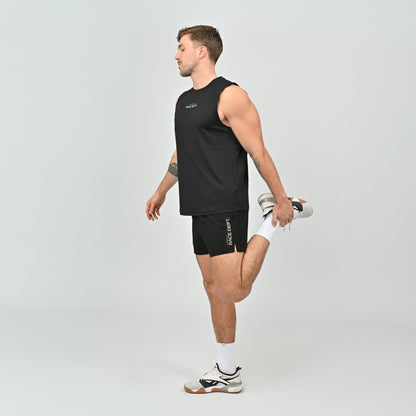 Man wearing a black sleeveless running tank and shorts, stretching.
