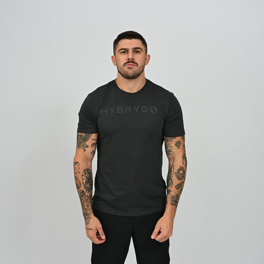 Front view of male athlete wearing black Hybryd Delta Core athletic gym t-shirt   