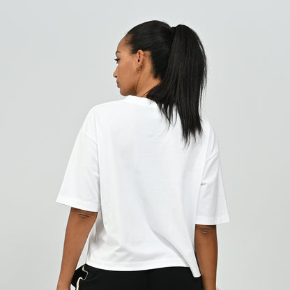 Back view of a model wearing the white oversized HAFT collegiate American football jersey t-shirt by Hybryd.