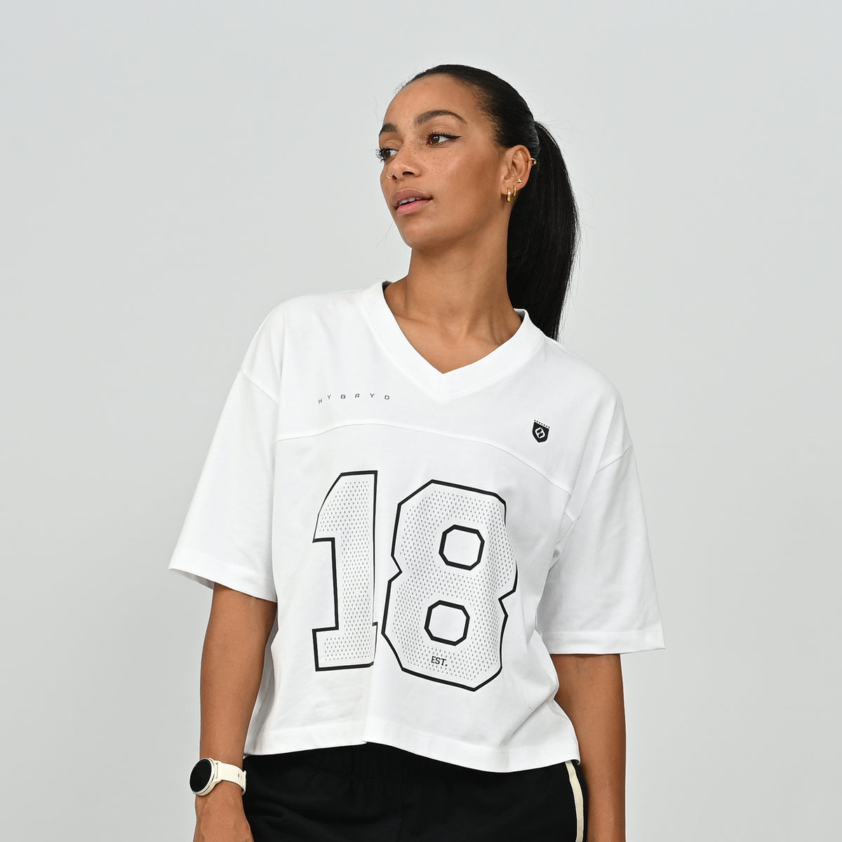 Close-up front view of the white HAFT collegiate American football jersey t-shirt by Hybryd showing the number 18 graphic print