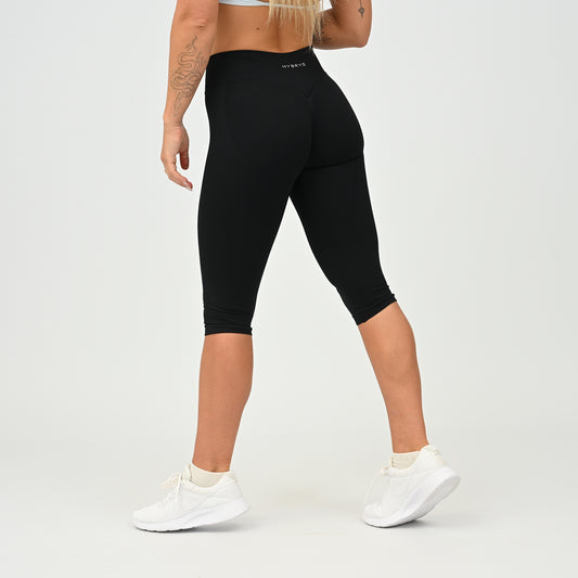 Women’s Emily black capri leggings, side view showing cropped fit