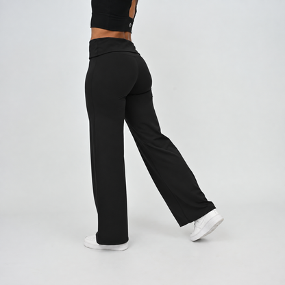 Women’s black wide leg leggings showing side fit and fold-over waistband