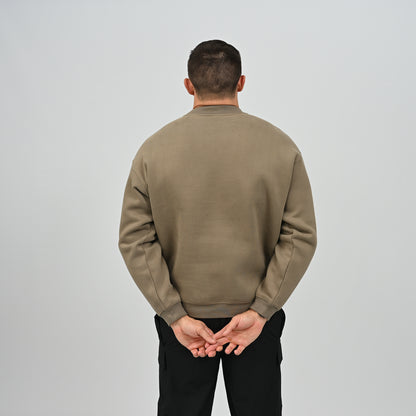 Back view of model wearing the khaki Jasper relaxed fit fleece crew neck sweatshirt.