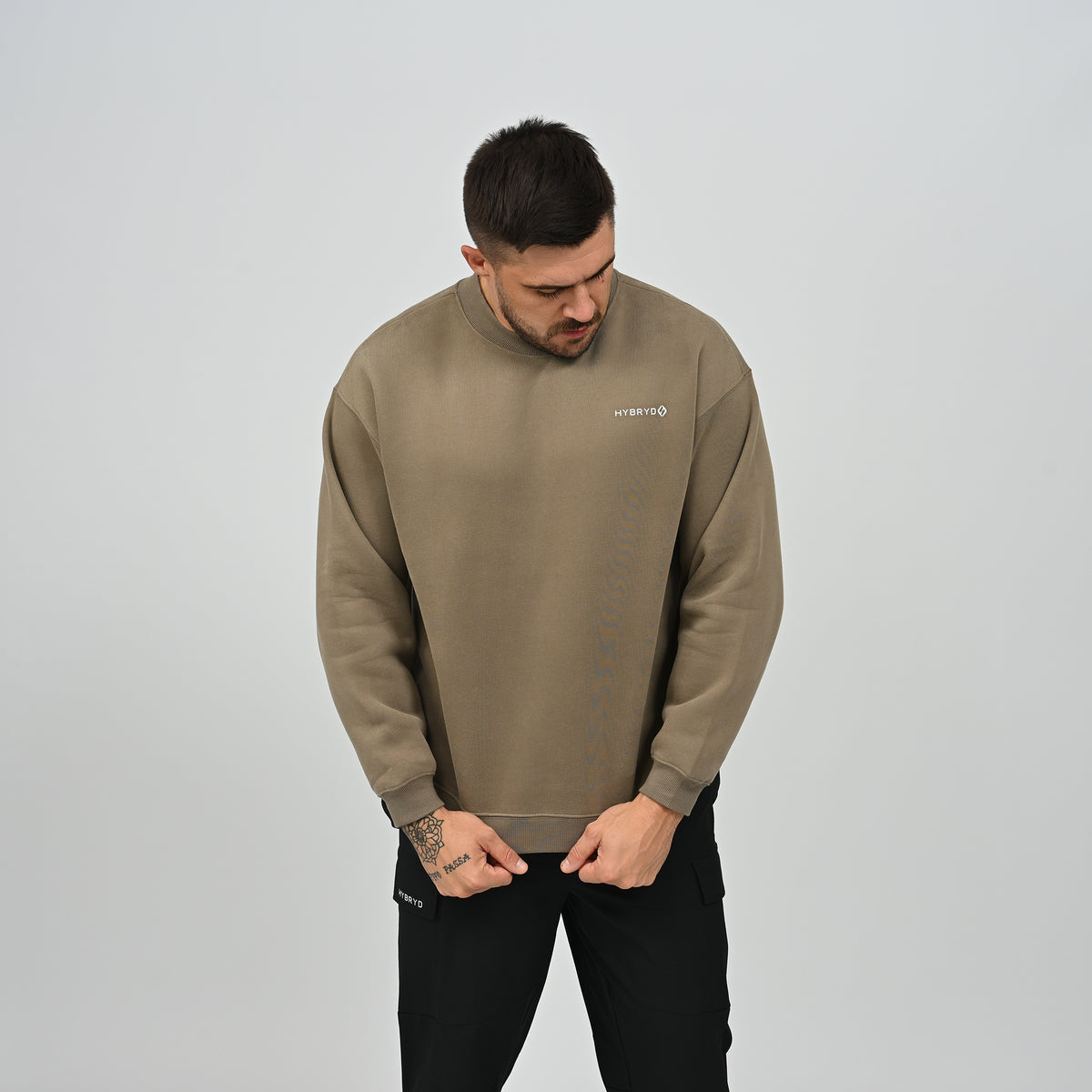 Front view of model wearing the khaki Jasper relaxed fit fleece crew neck sweatshirt.