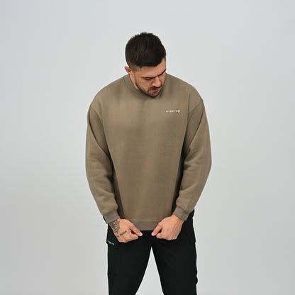 Front view of model wearing the khaki Jasper relaxed fit fleece crew neck sweatshirt.