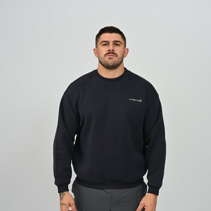 Front view of model wearing the Jasper relaxed fit crew neck fleece sweatshirt in navy.