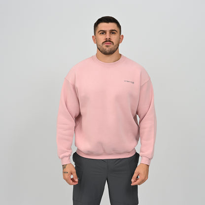 Model wearing the pink Jasper relaxed fit crew neck sweatshirt, straight front shot.