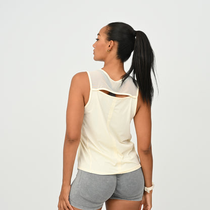 Back view of HYBRYD Molly women’s gym vest in Butter with breathable open-back detail