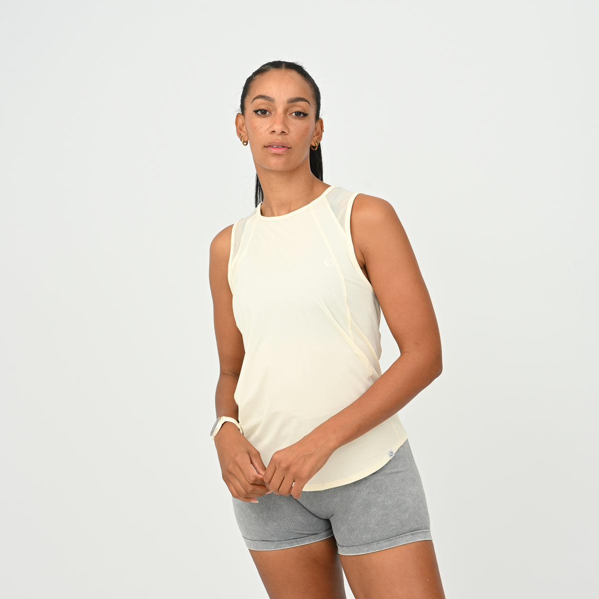 HYBRYD Molly women’s HYROX vest in Butter shown from a front three-quarter angle